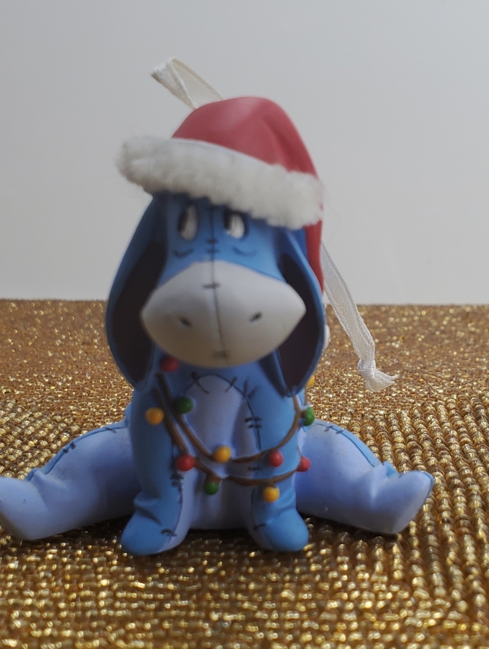 EEYORE Hallmark Ornament Sitting Wearing Santa Hat Tangled Lights (C41)